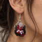 Model wearing handmade crystal cauldron earrings with real quartz crystals