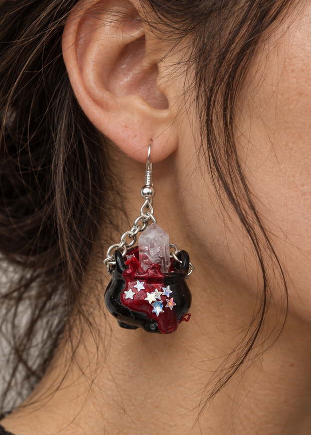 Model wearing handmade crystal cauldron earrings with real quartz crystals