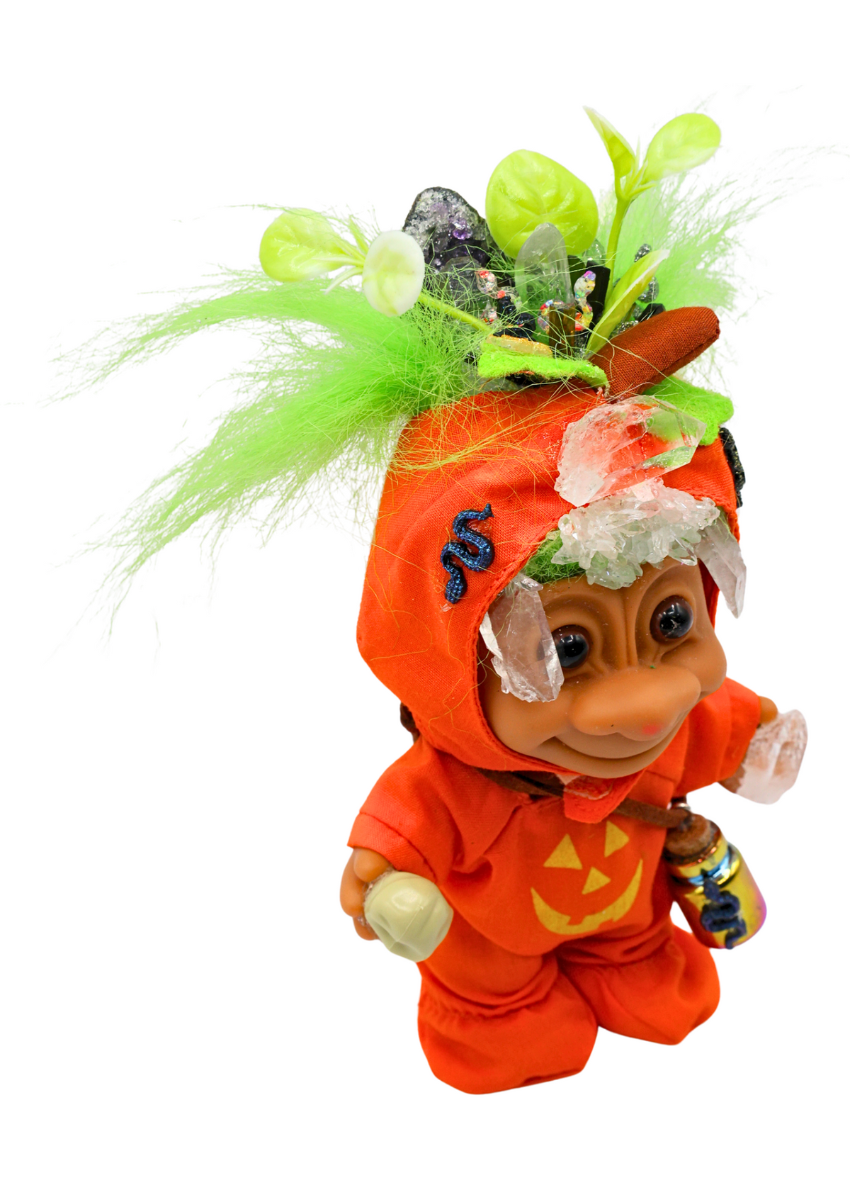 Hexley one-of-a-kind crystal guardian sculpture angled view showing orange Halloween outfit, green hair and miniature skull