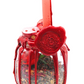Large Love Spell Jar front view on white background with red candle, red wax drips and herbal contents