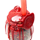 Angled top view of Large Love Spell Jar showing red candle, wax seal, decorative crystals and glittering wax