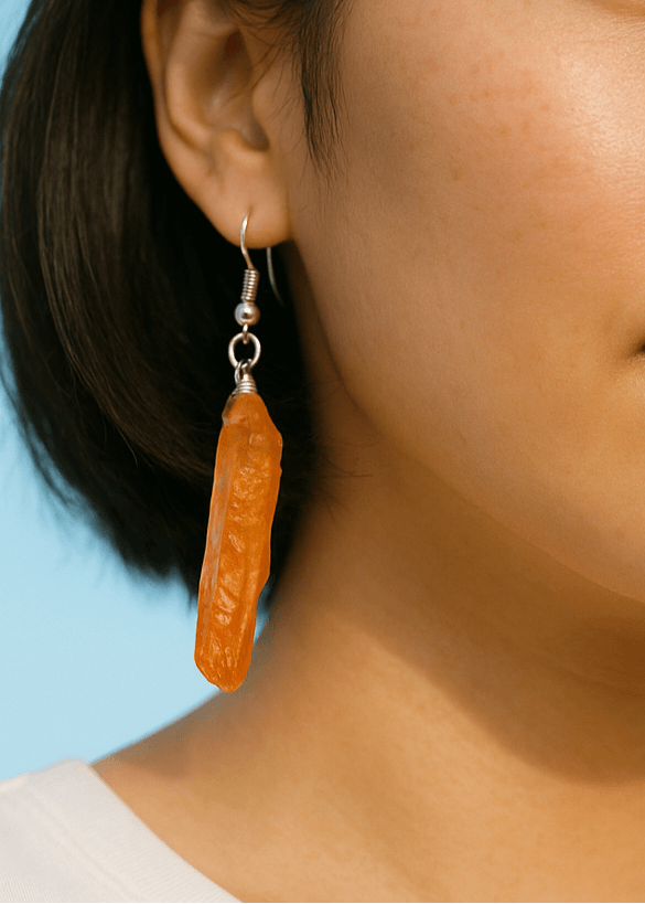 woman wearing orange aura quartz earrings