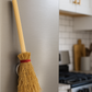 witch broom magnet on fridge